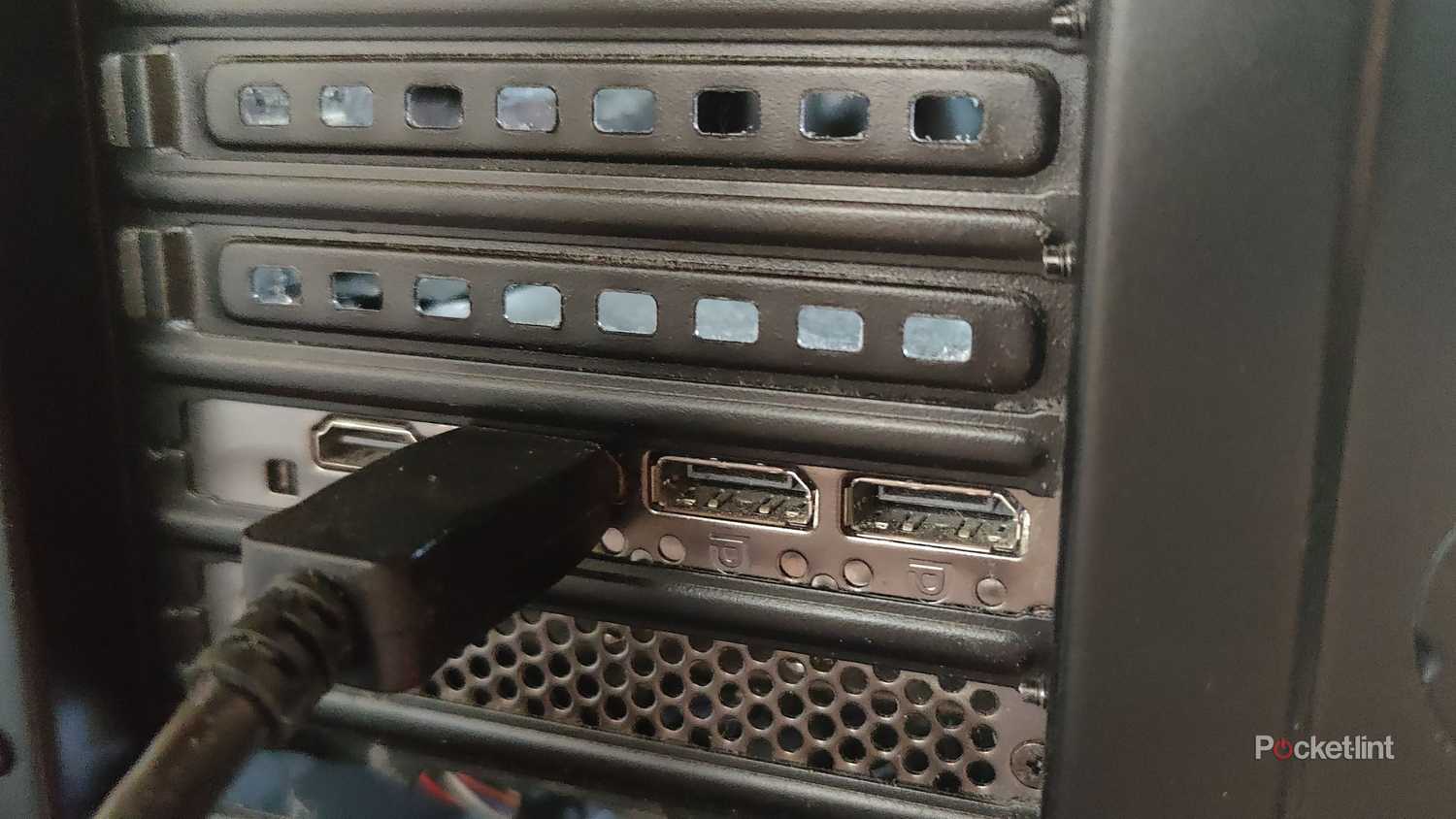 A DisplayPort cable plugged into a PC.