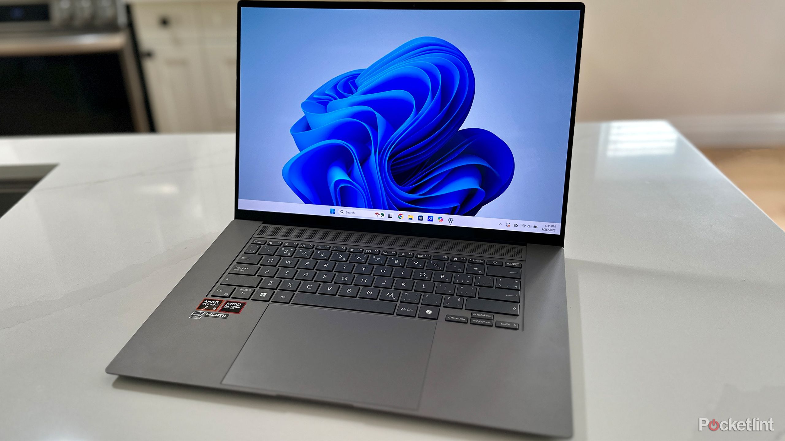 Windows 11 laptop on kitchen counter.