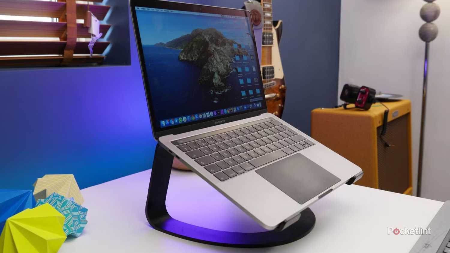A MacBook Pro and a laptop stand.