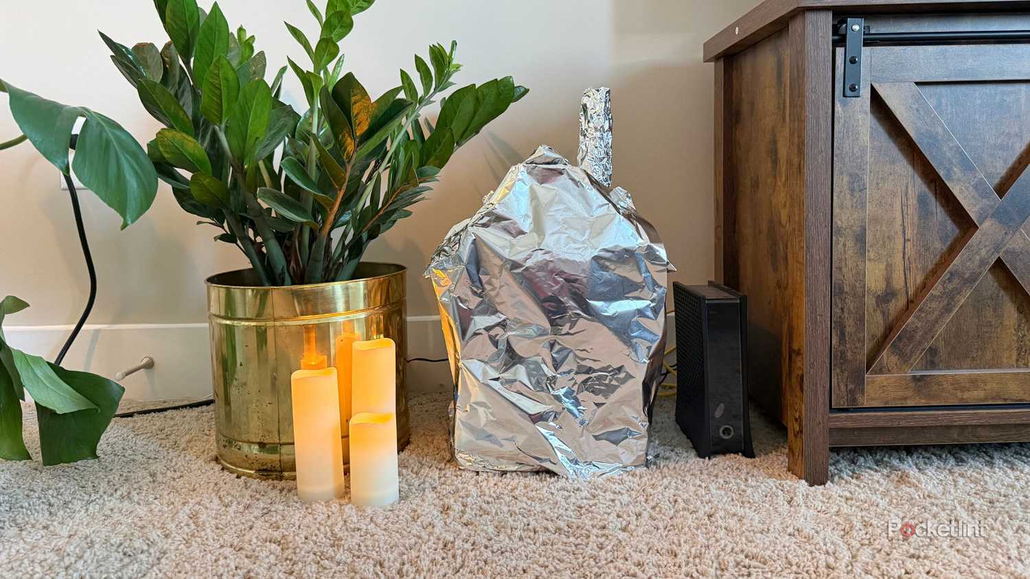 Covering my router in an aluminum foil house. 