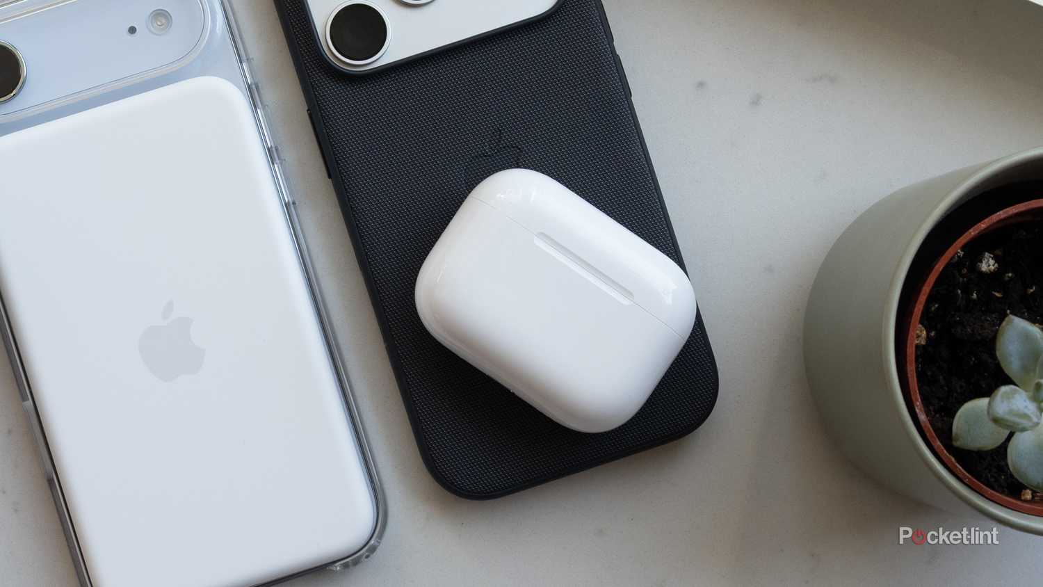 AirPods Pro 3 in a case on top of the iPhone 17 Pro 