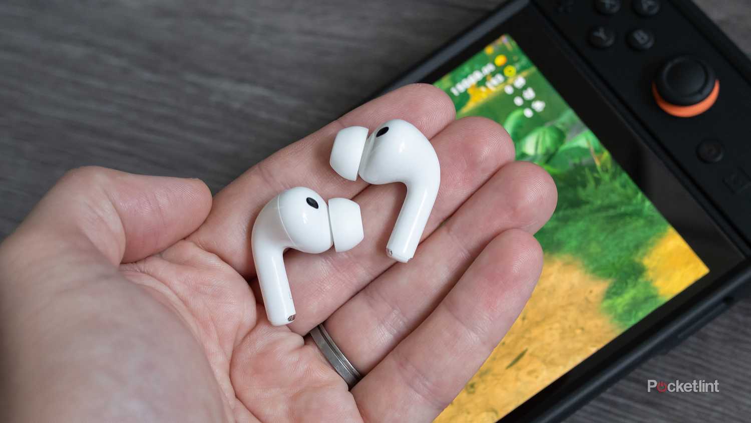 AirPods Pro 3 earbuds in a hand