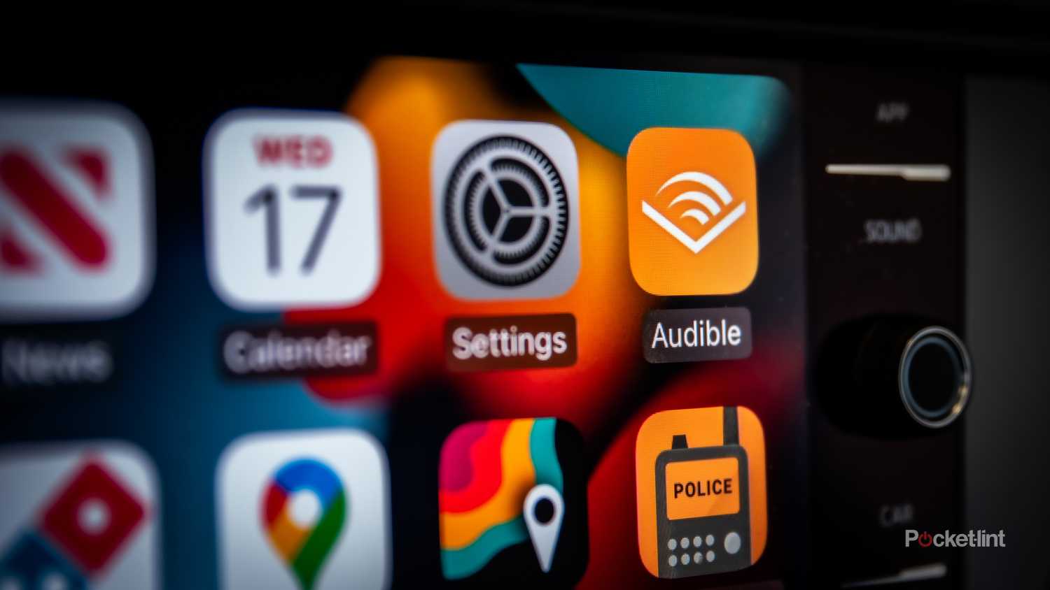 A still photo of the Apple CarPlay screen with the Audible app in focus. 