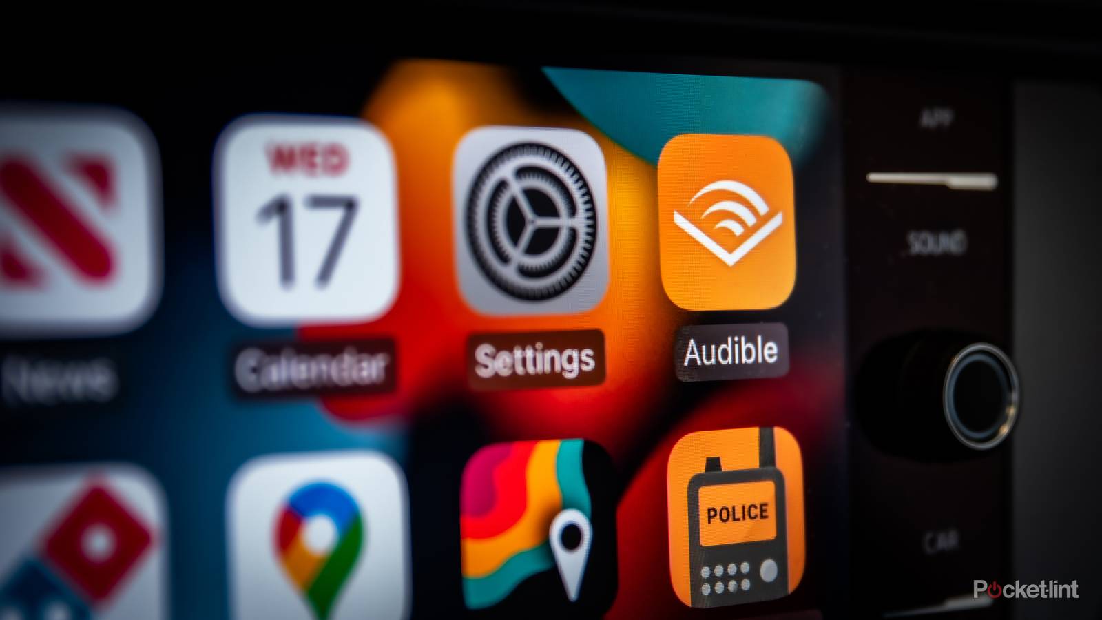 A still photo of the Apple CarPlay screen with the Audible app in focus. 