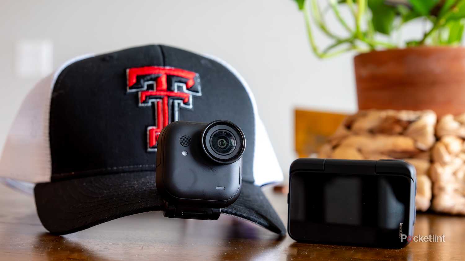 A still photo of the Insta 360 GO clipped onto a hat. 