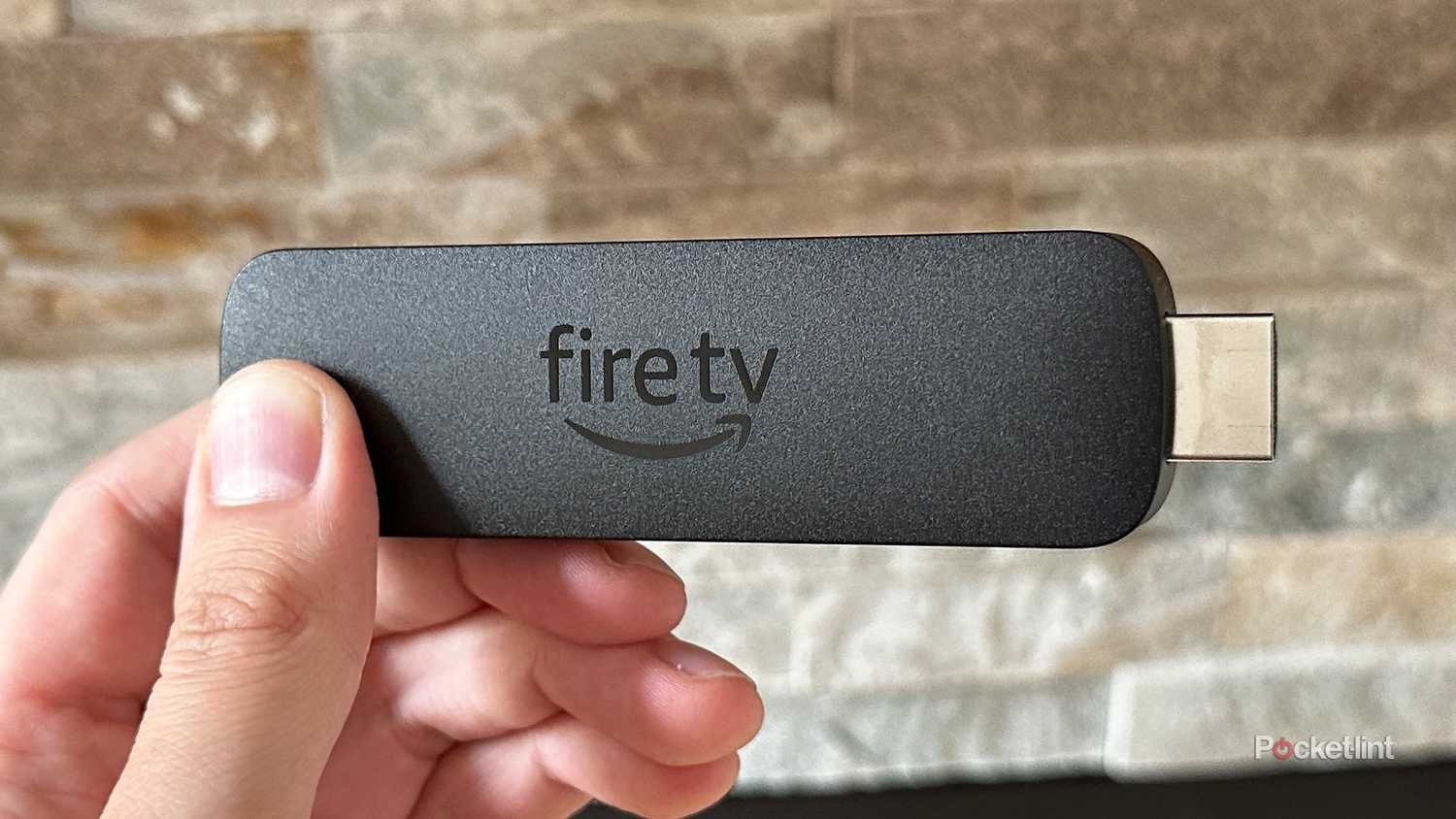 Amazon's Fire TV Stick being held 