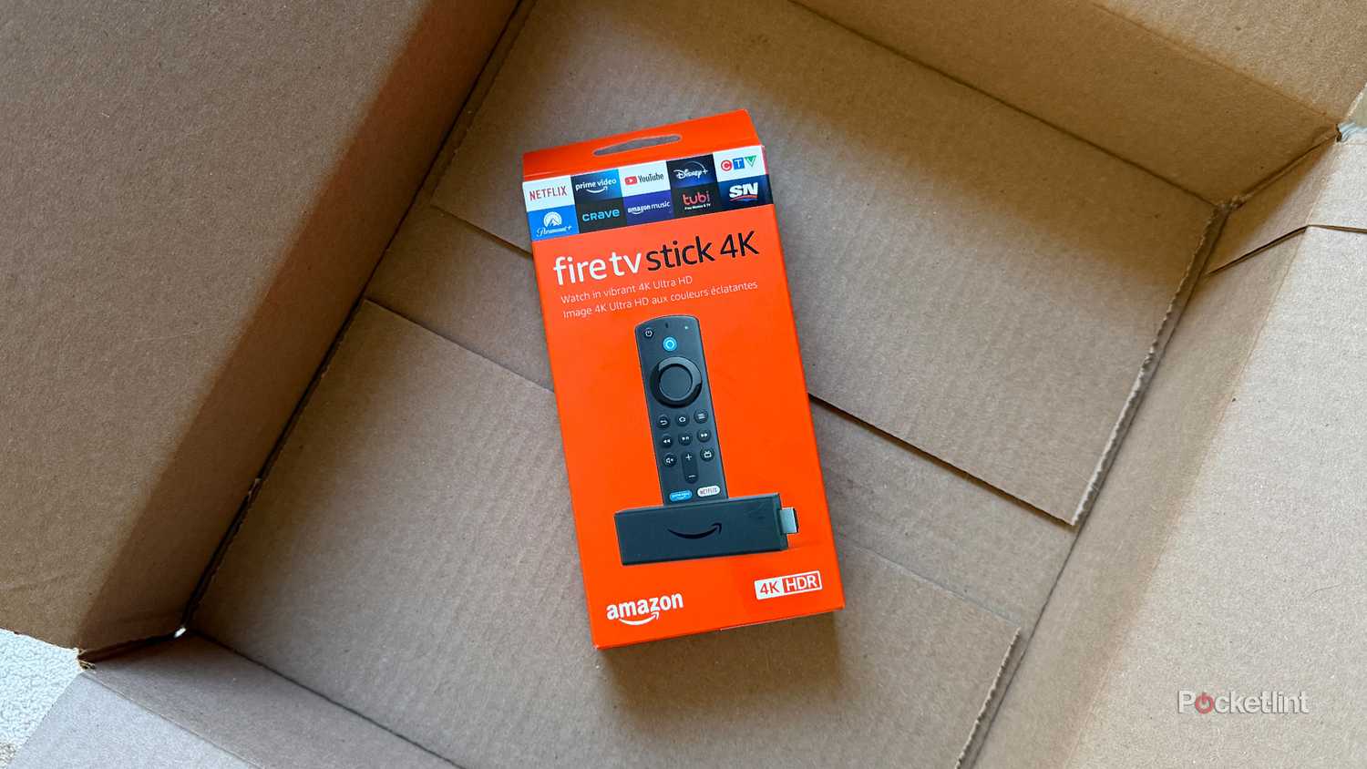 Fire TV Stick 4K in shipping box.
