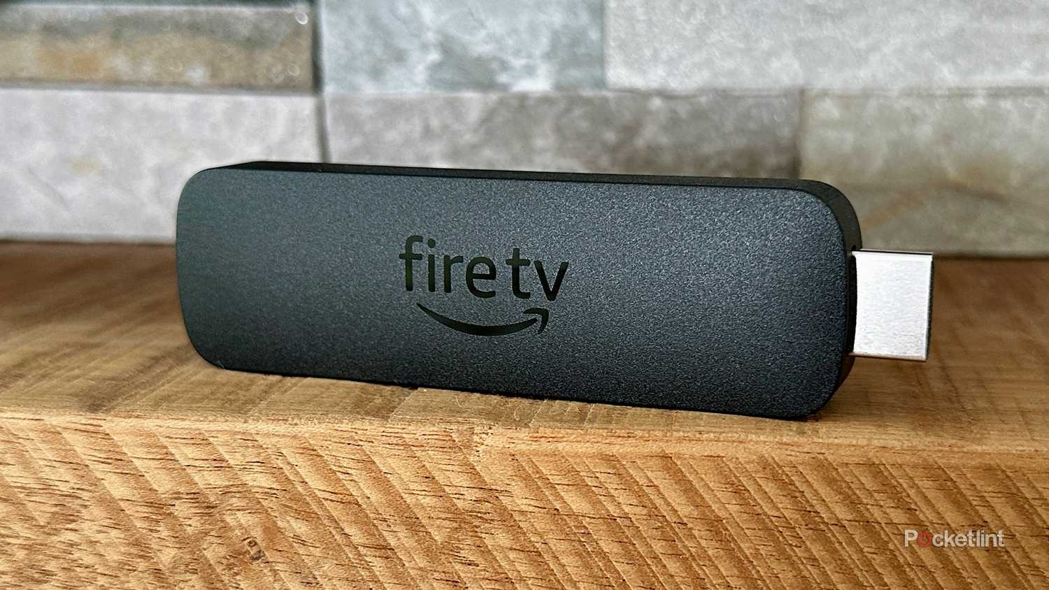 Amazon Fire TV Stick 4K Max on fireplace mantel.