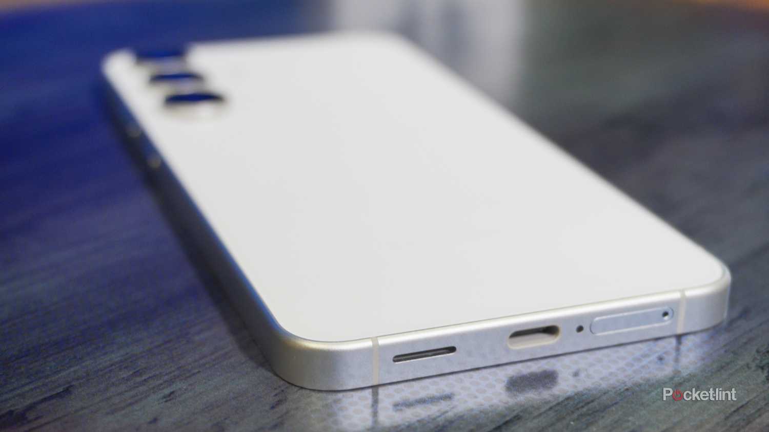 The USB-C port, speaker, and SIM tray on a Galaxy S25 FE.