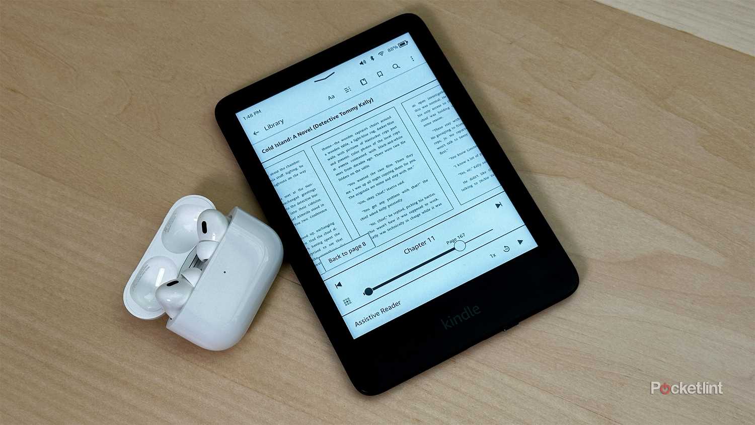 Kindle next to AirPods.