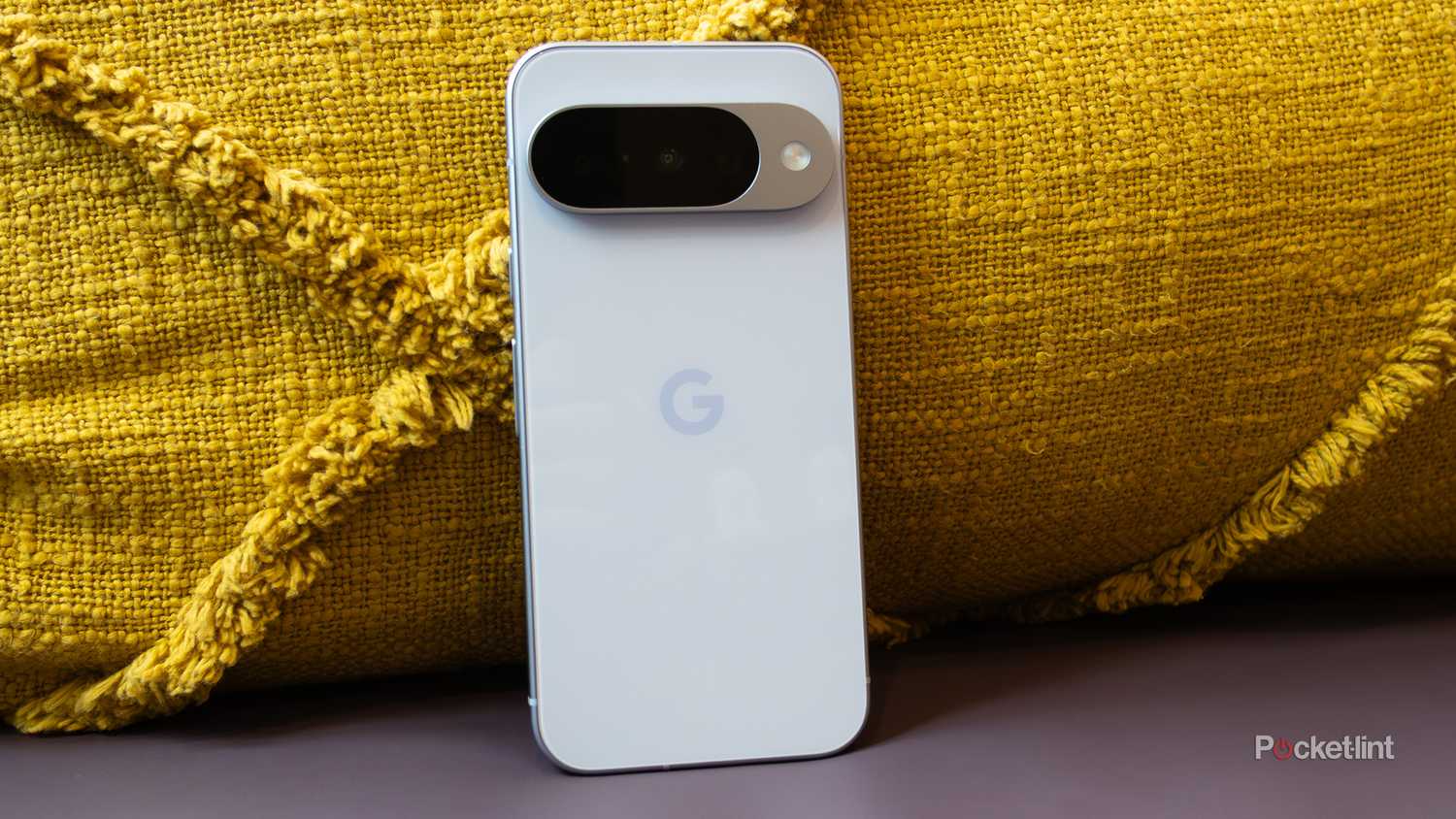 Google's Pixel 10 Pro sitting against a pillow