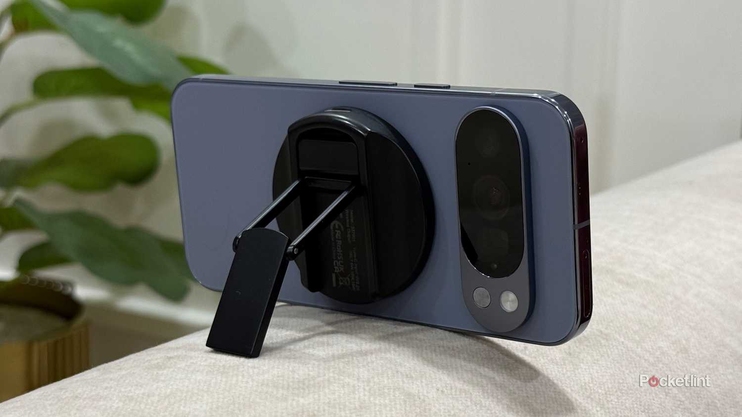 Pixel 10 Pro with a MagSafe stand attached to the back