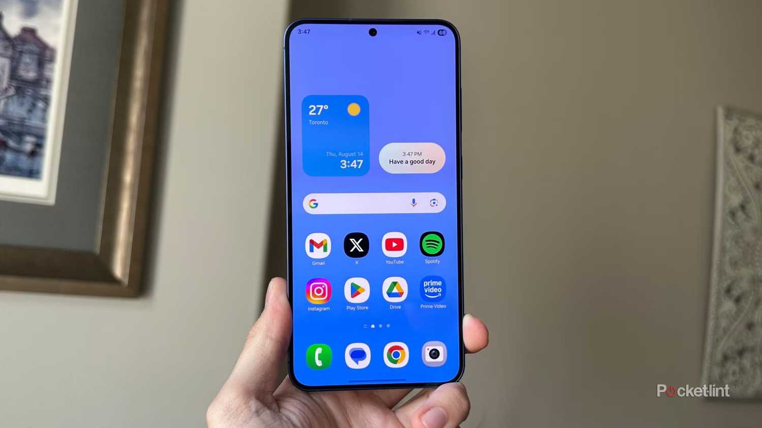 Holding a Samsung S25 in hand with homescreen up. 