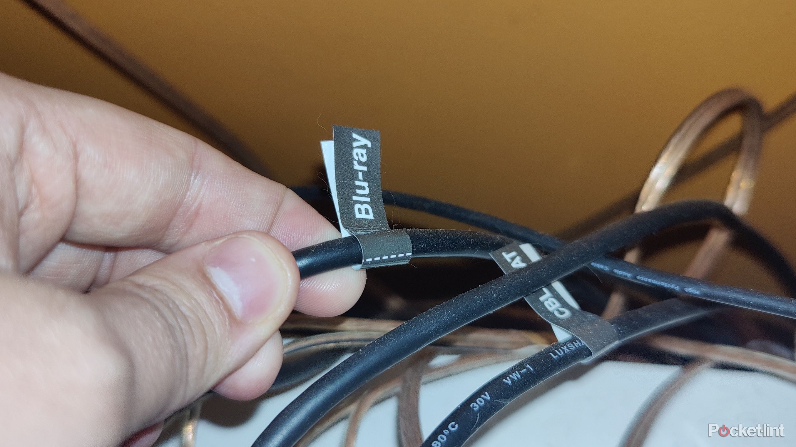 Screenshot of holding HDMI cable labeled with Blu-ray sticker.