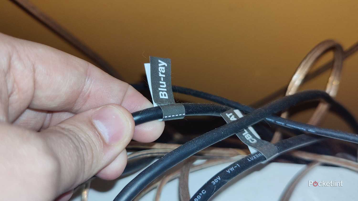 Screenshot of holding HDMI cable labeled with Blu-ray sticker.
