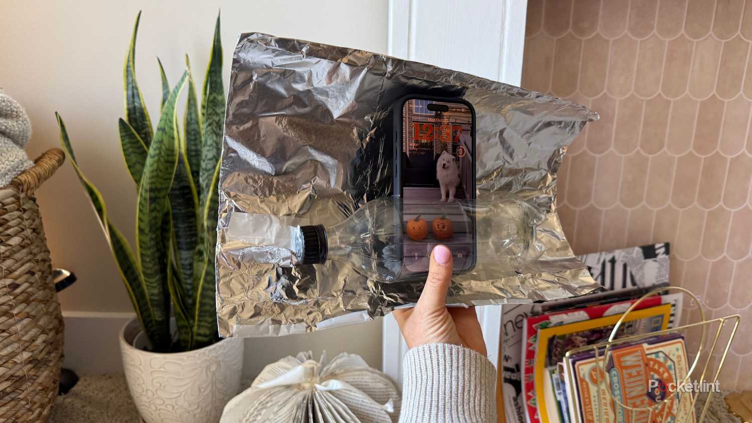 Aluminum foil with an iPhone. 