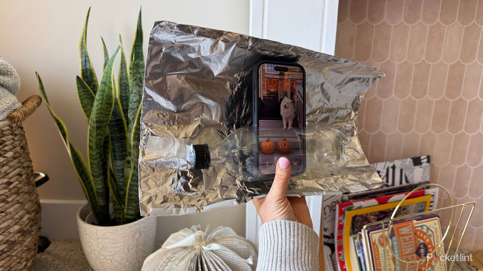Aluminum foil with an iPhone. 