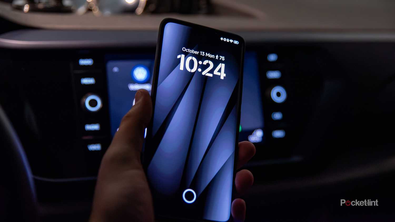 A still photo of a locked android phone engaged in Android Auto.