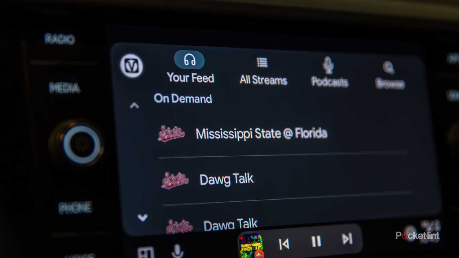 A still photo of the user interface of the Varsity Network Android Auto app. 