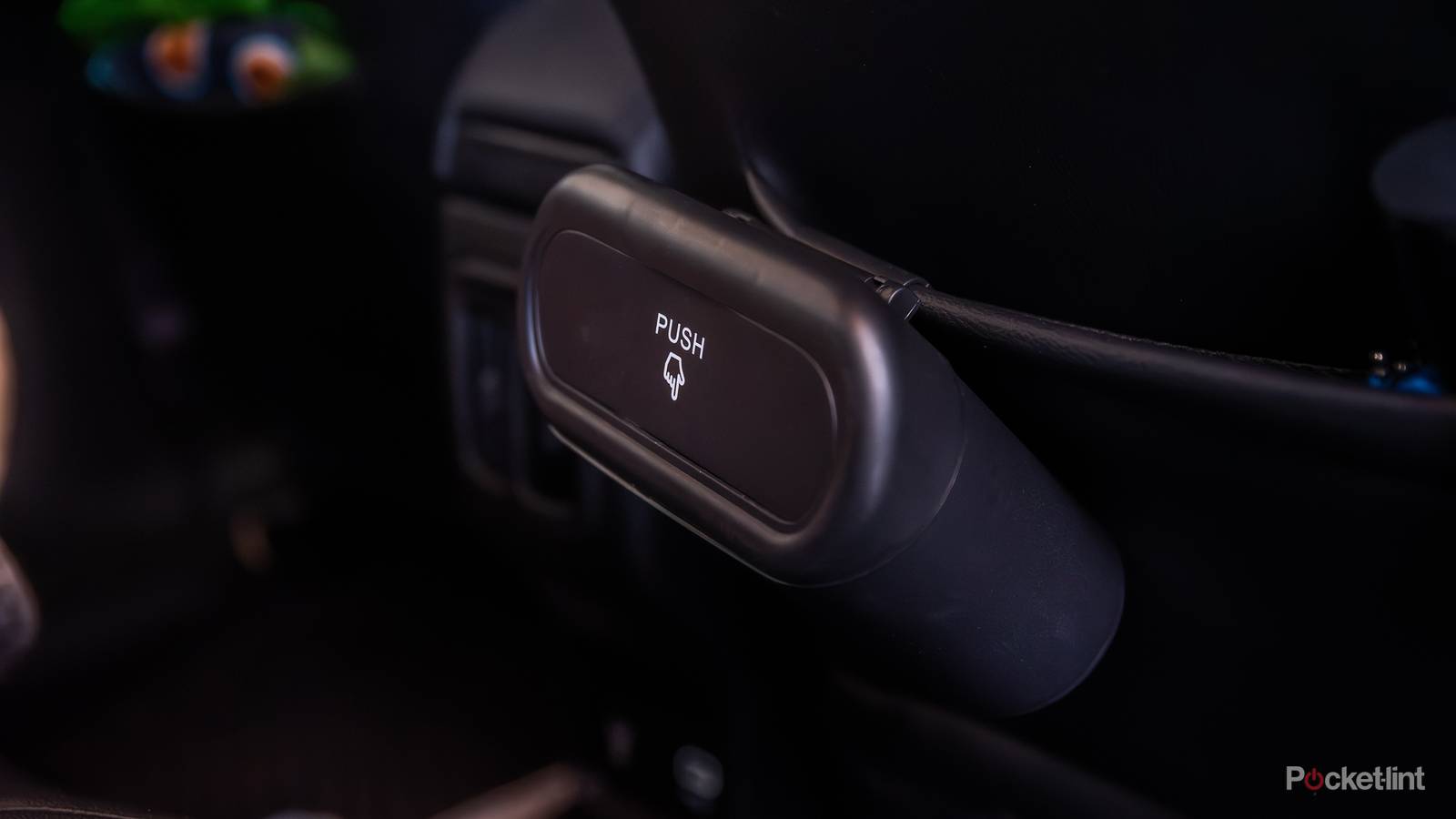 A still photo of the Accor car trash can in the back seat of a Jeep. 