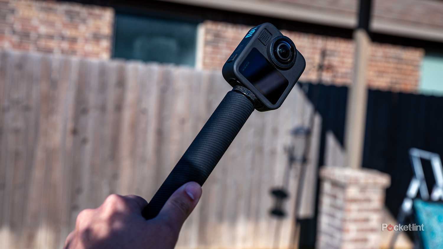 A still photo of the GoPro Max 2 on a selfie stick. 