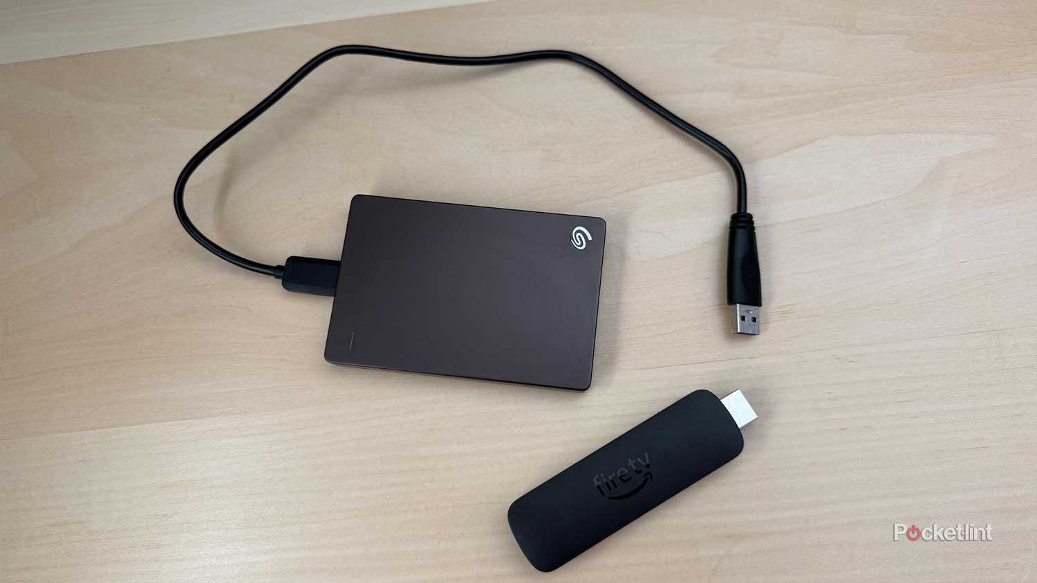 External hard drive next to Fire TV Stick.