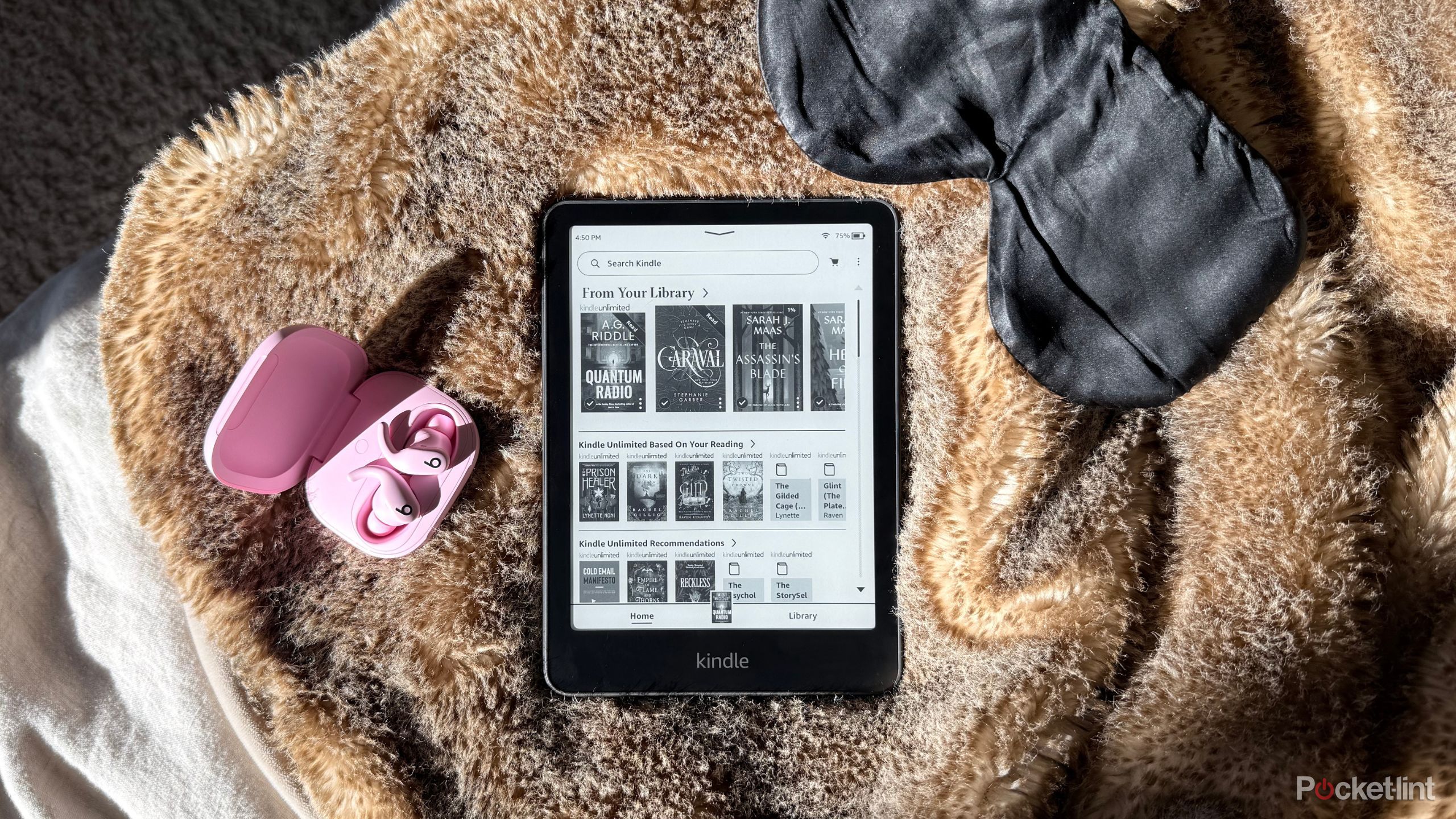 Kindle Paperwhite on a blanket. 
