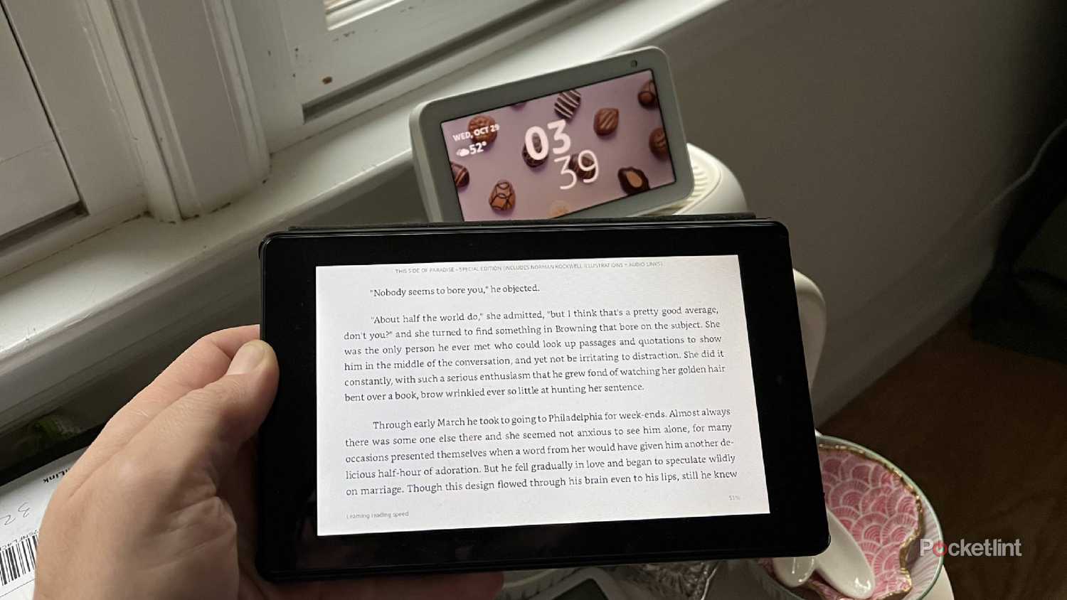 kindle fire in front of a speaker