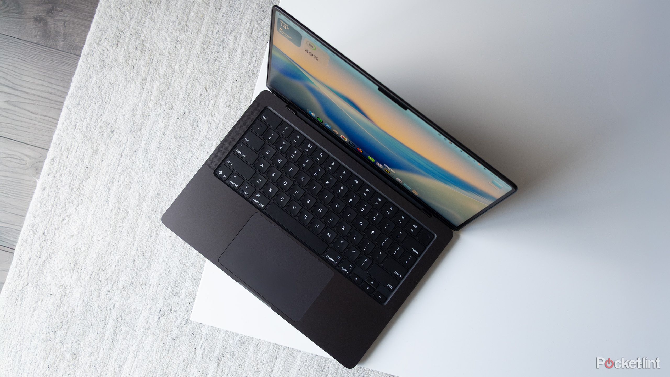 The M5 MacBook Pro from a top down perspective on a table 