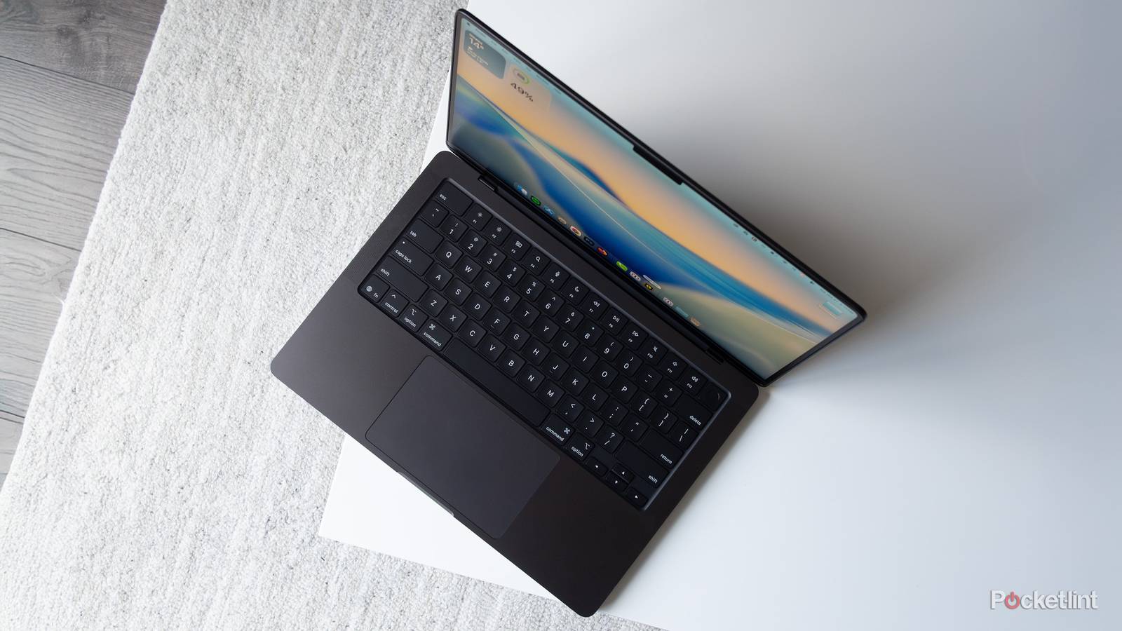 The M5 MacBook Pro from a top down perspective on a table 