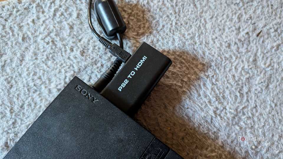 A PS2 to HDMI adapter plugged into a PS2.