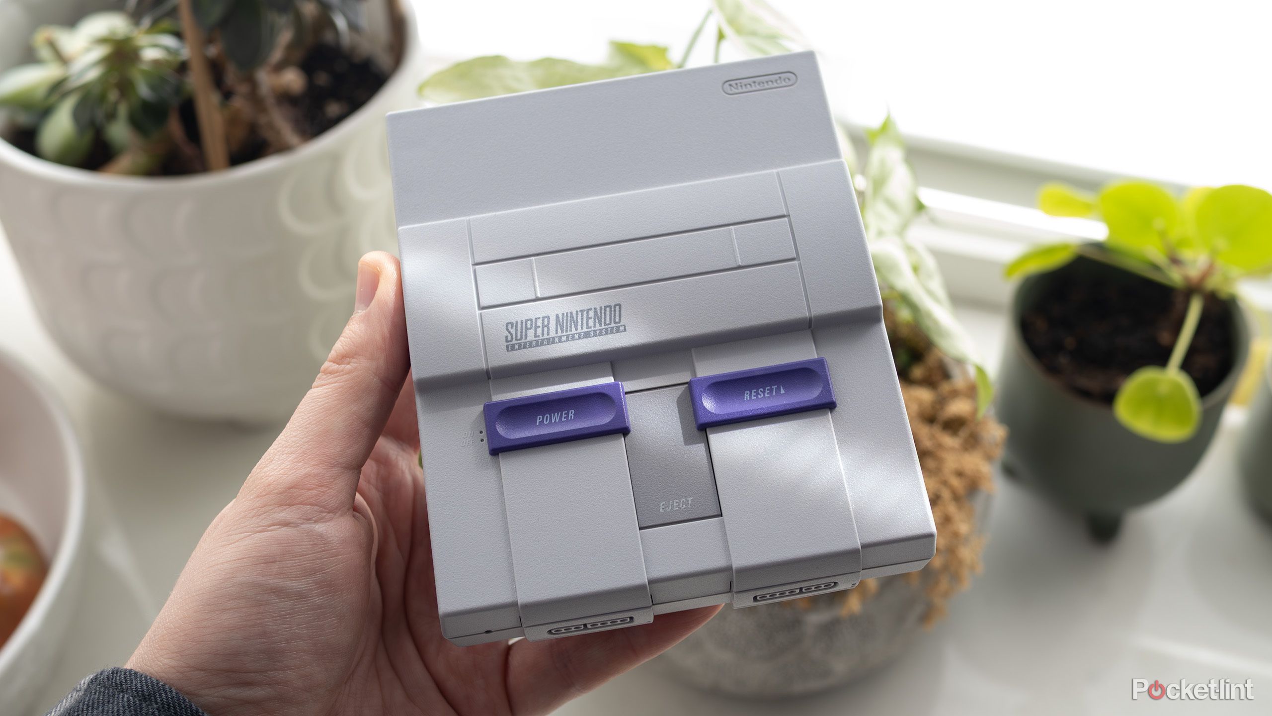 Super Nintendo Mini in hand. 