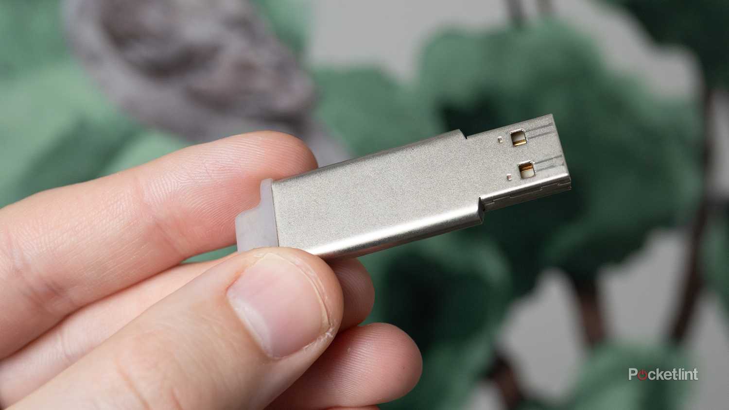 Holding a USB stick 