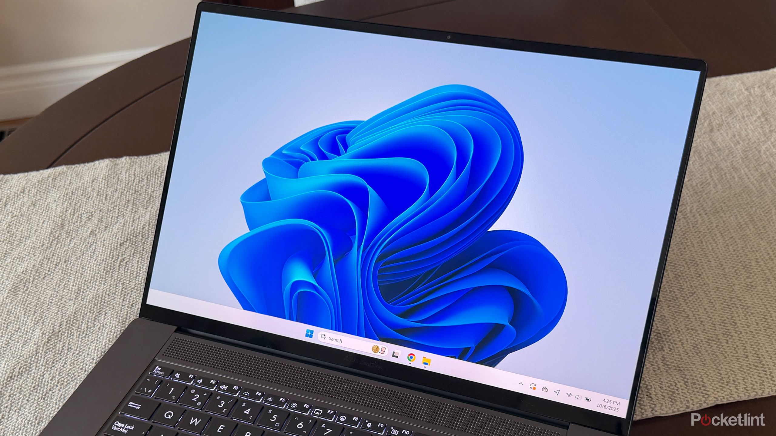 Windows 11 desktop on Asus laptop.