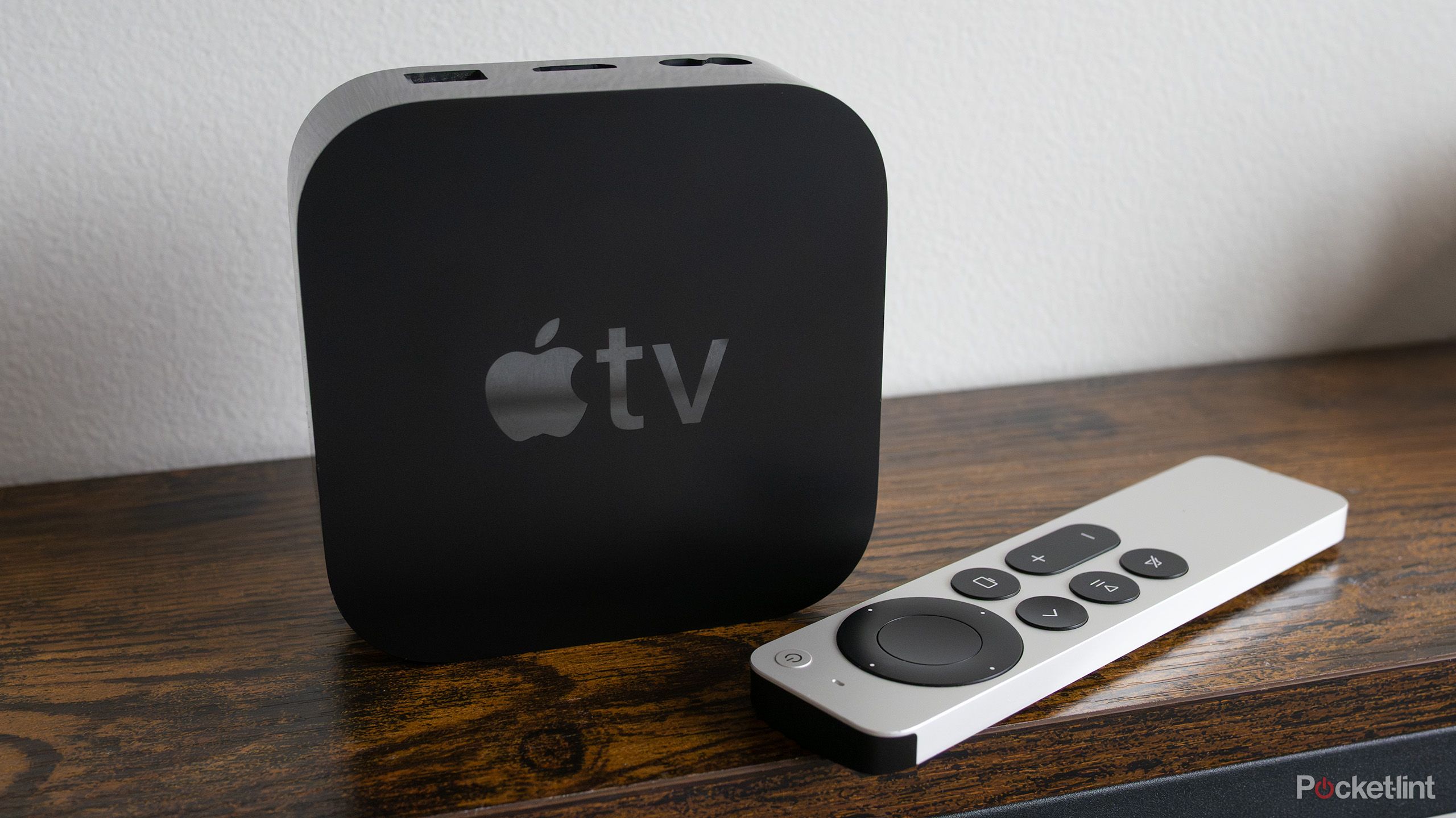 The Apple TV 4K sitting on a shelf 