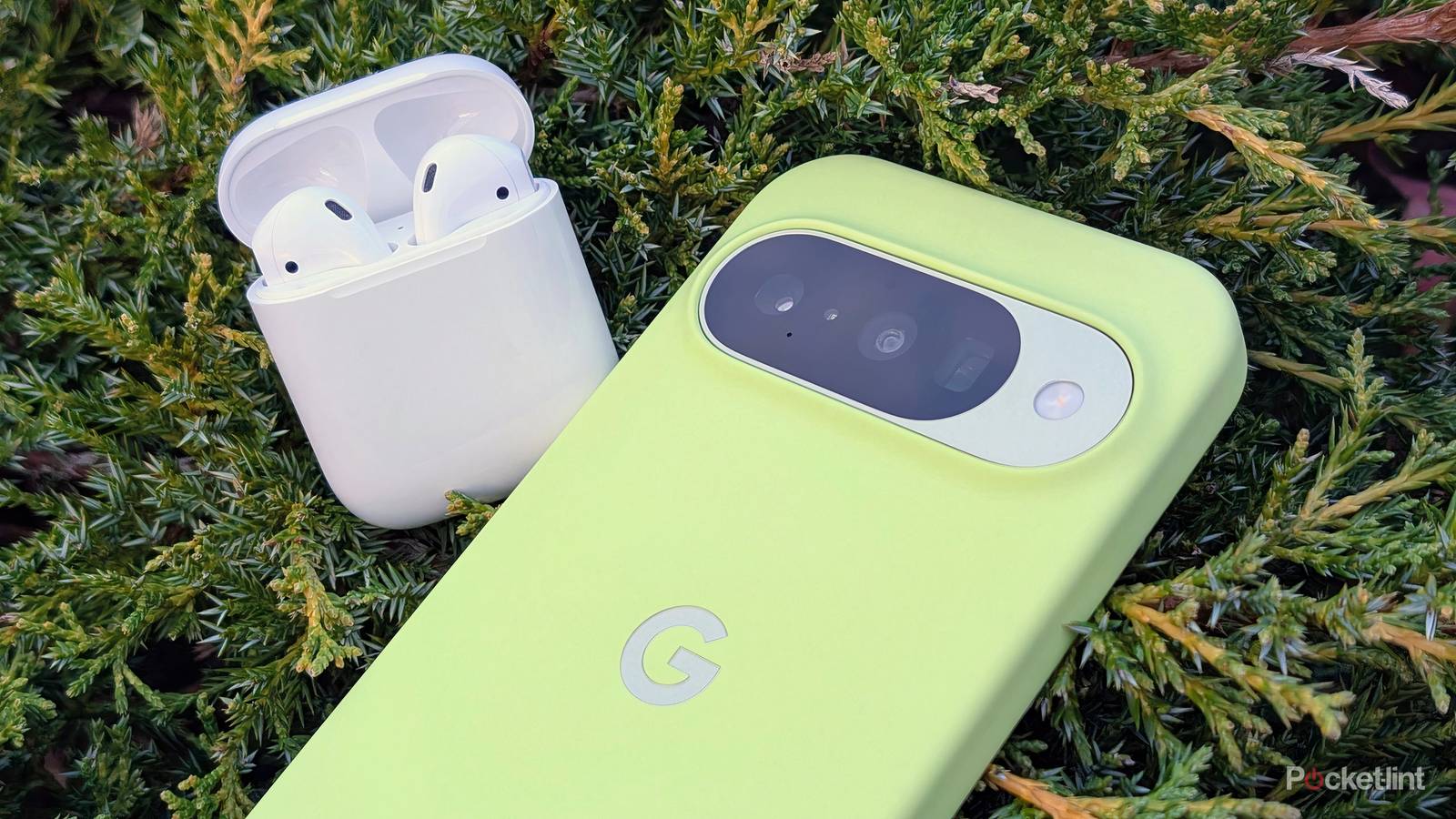 A Google Pixel 10 next to Apple AirPods second generation.