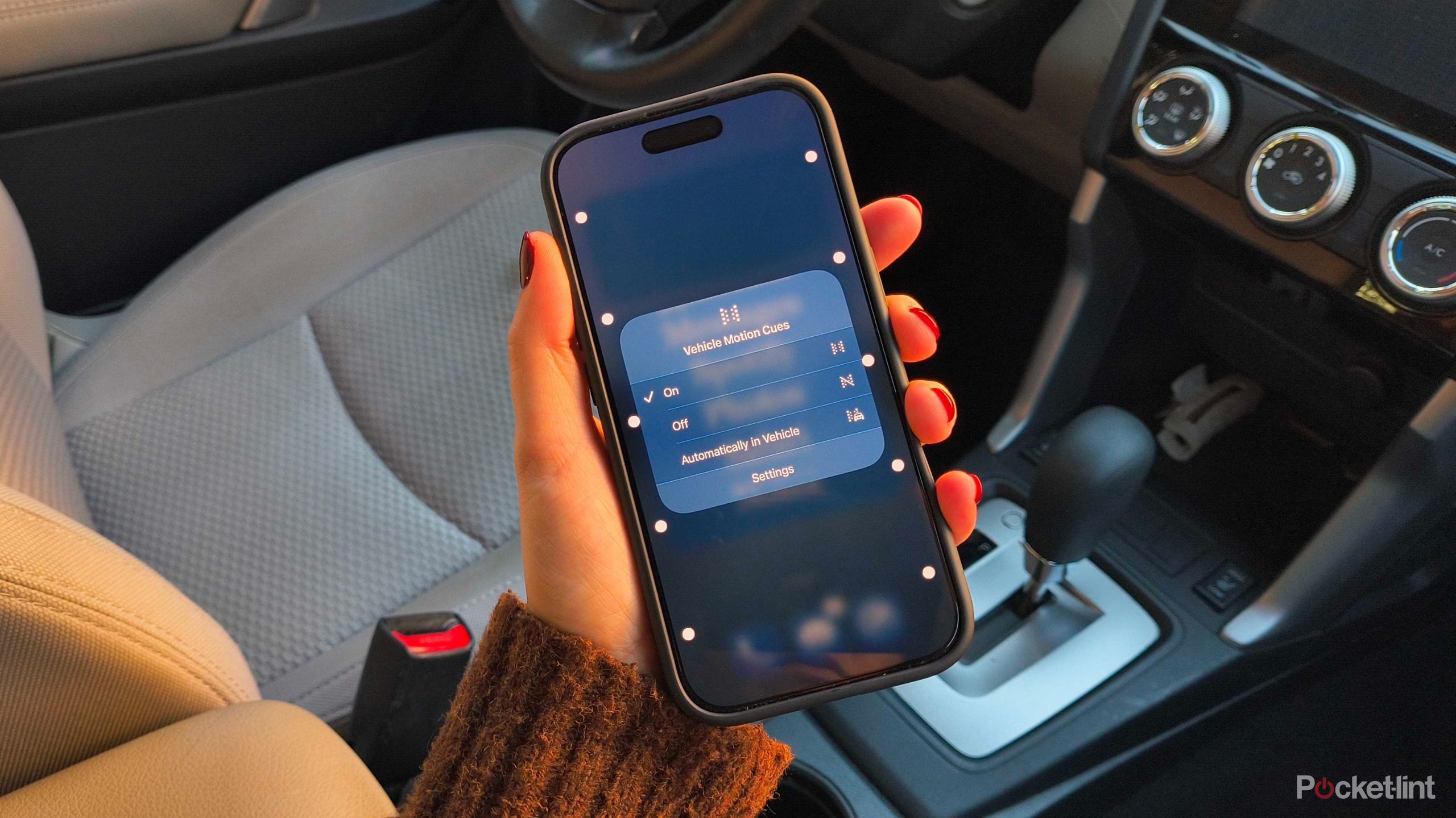 An iPhone with Vehicle Motion Cues on. 