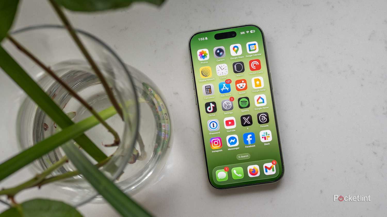 The iPhone 17 beside plans on a table