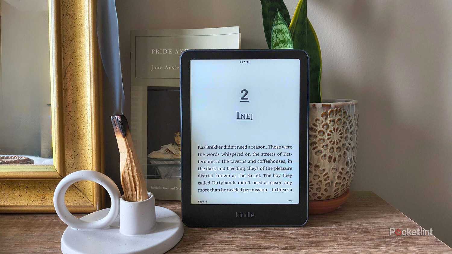A Kindle Paperwhite in front of burning wood. 