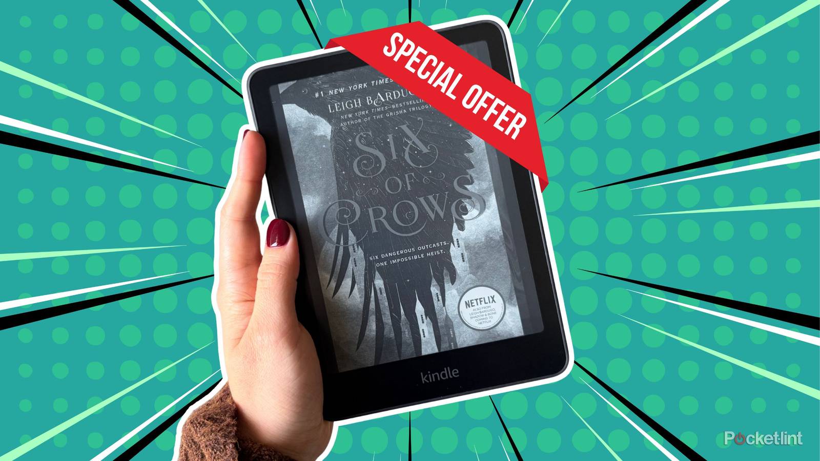 Holding a Kindle Paperwhite with a special offer. 