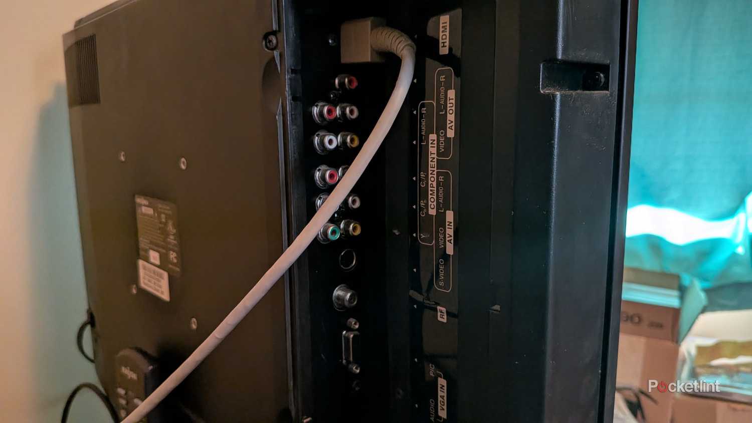 An HDMI cable plugged into an Insignia TV.