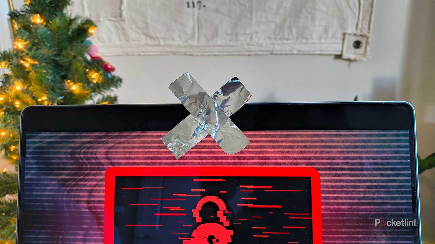 Tin foil covering a webcam in an X. 