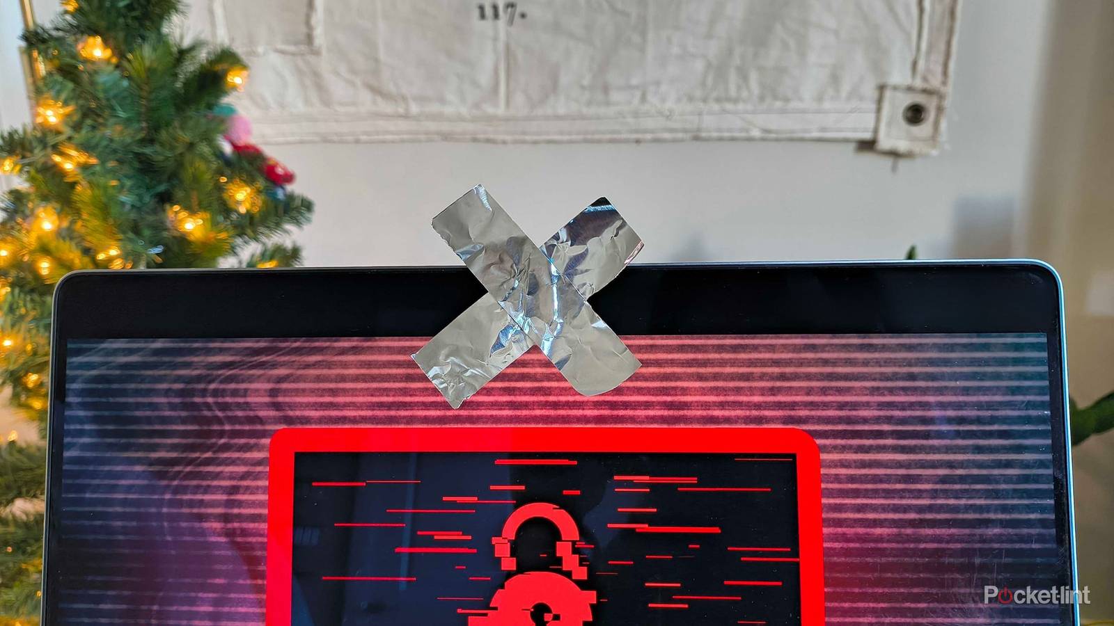 Tin foil covering a webcam in an X. 