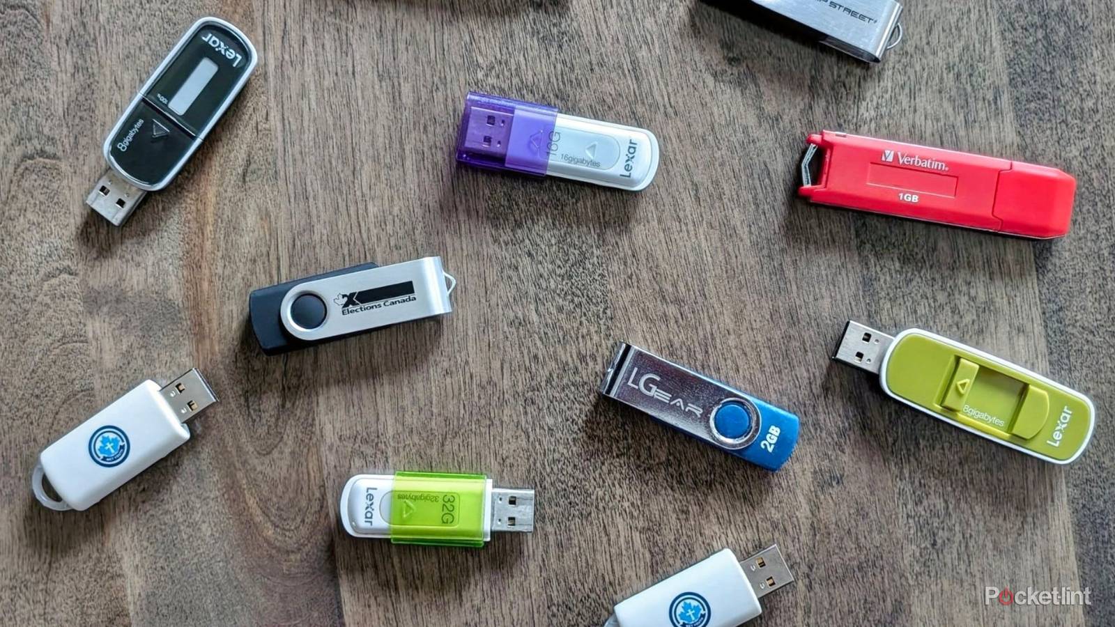 An assortment of USB flash drives on a table.