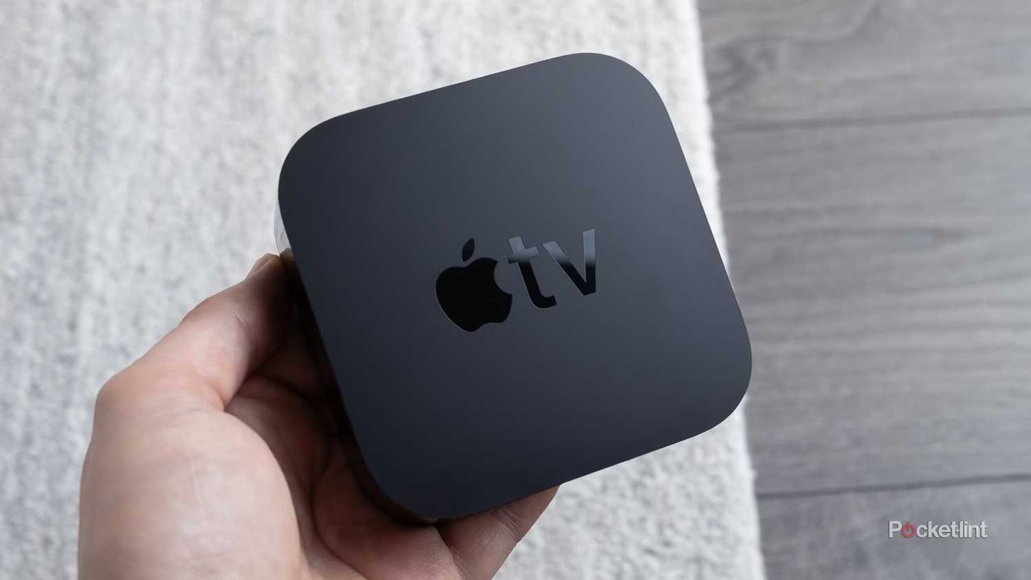 Person holding Apple TV 4K.