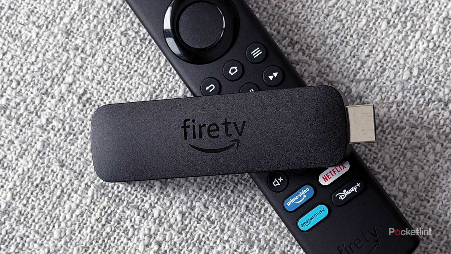 Fire TV Stick 4K Max next to remote.