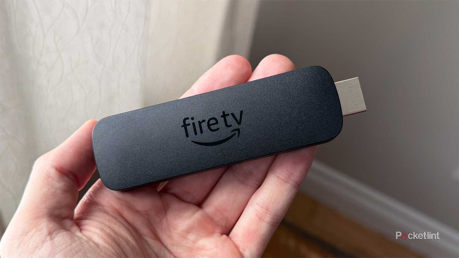 Person holding Fire Stick.