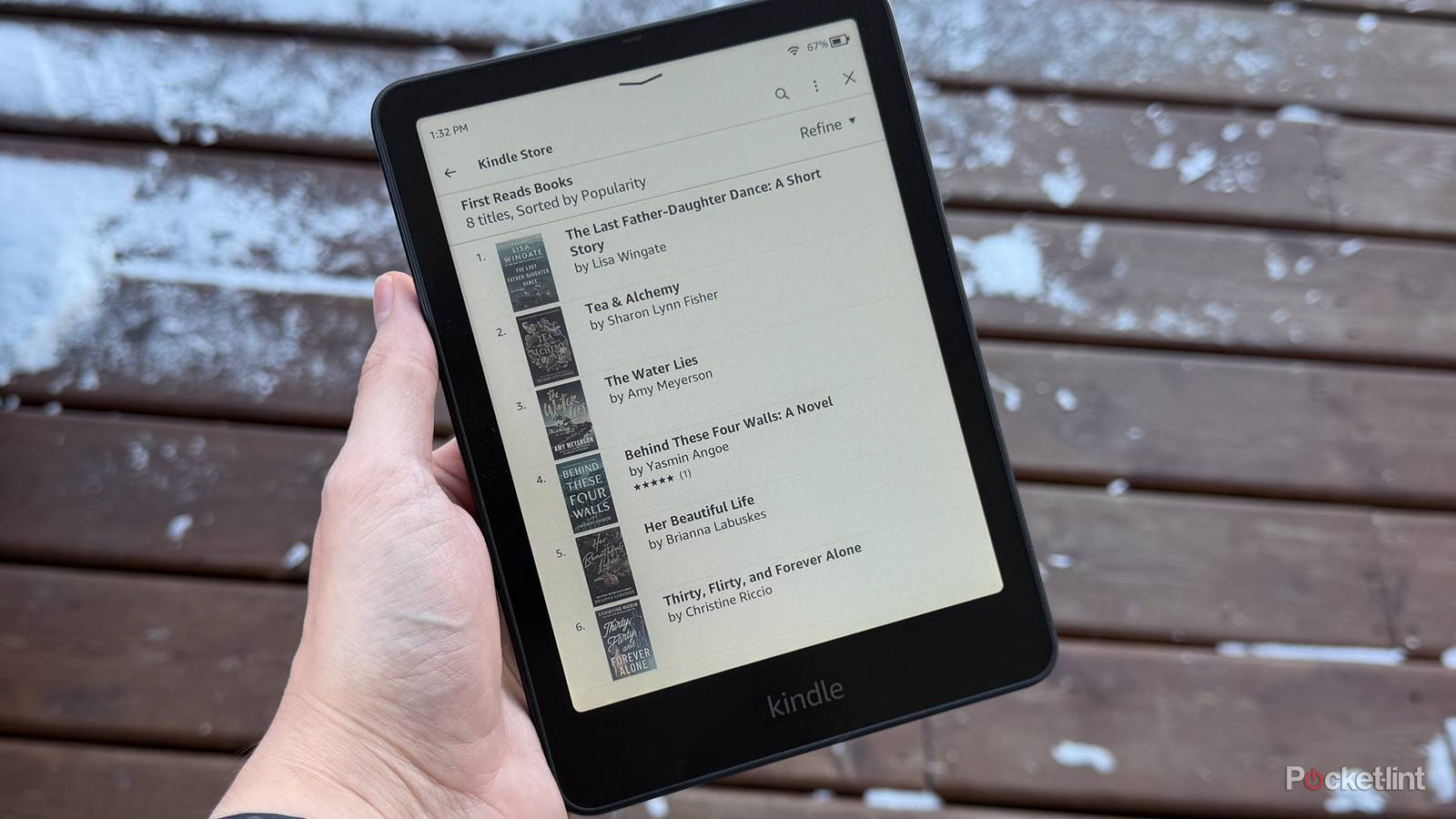 Kindle in front of snow covered deck.