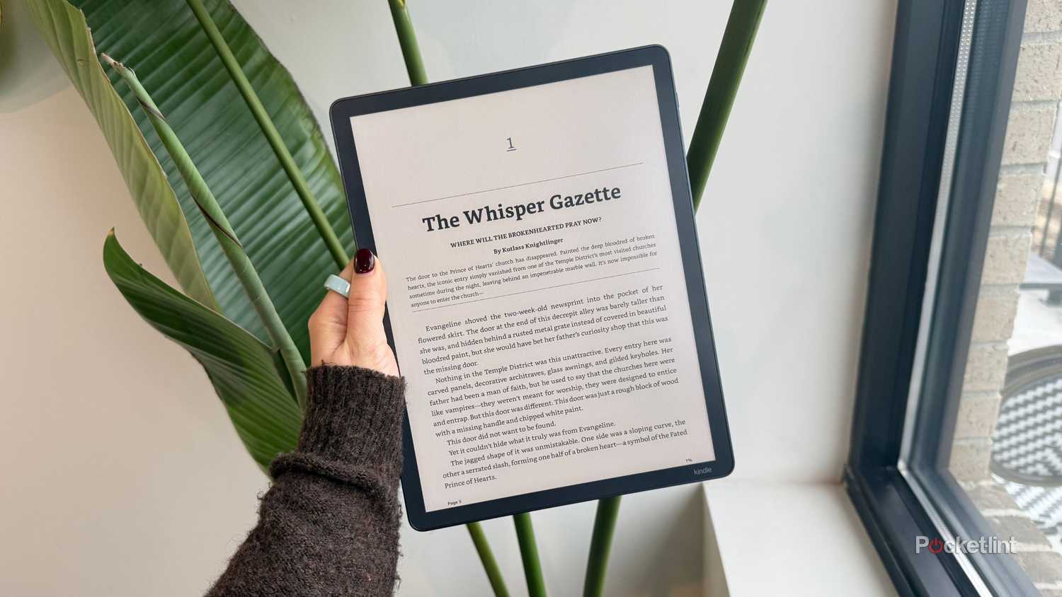 A Kindle Scribe Colorsoft with a book on it. 