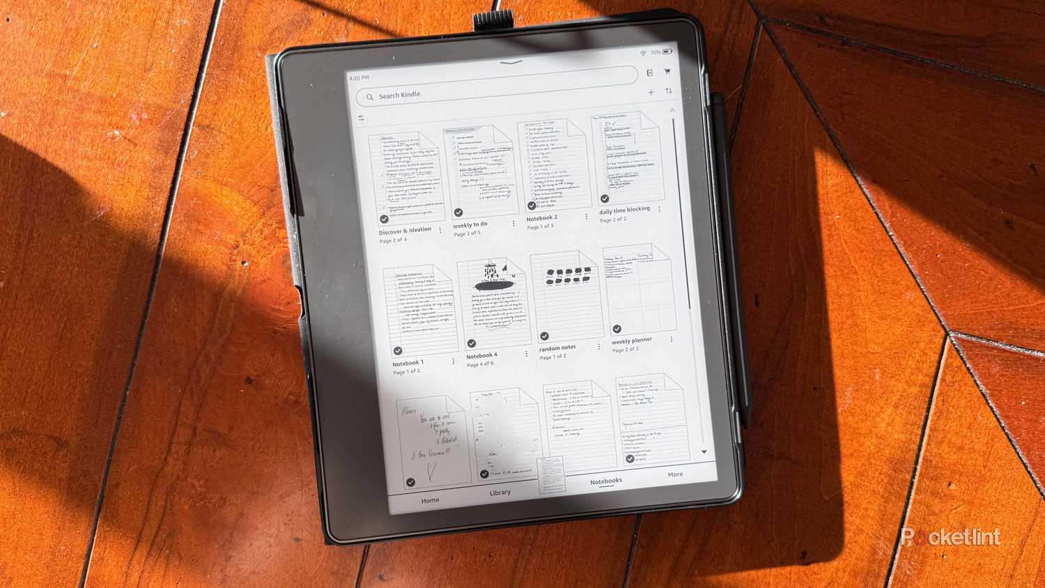 A Kindle Scribe on a dining room table. 